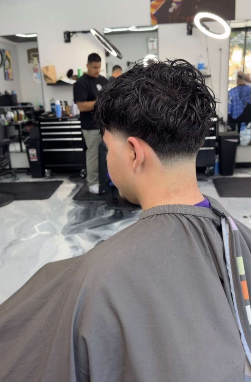 Wavy textured top with low taper fade