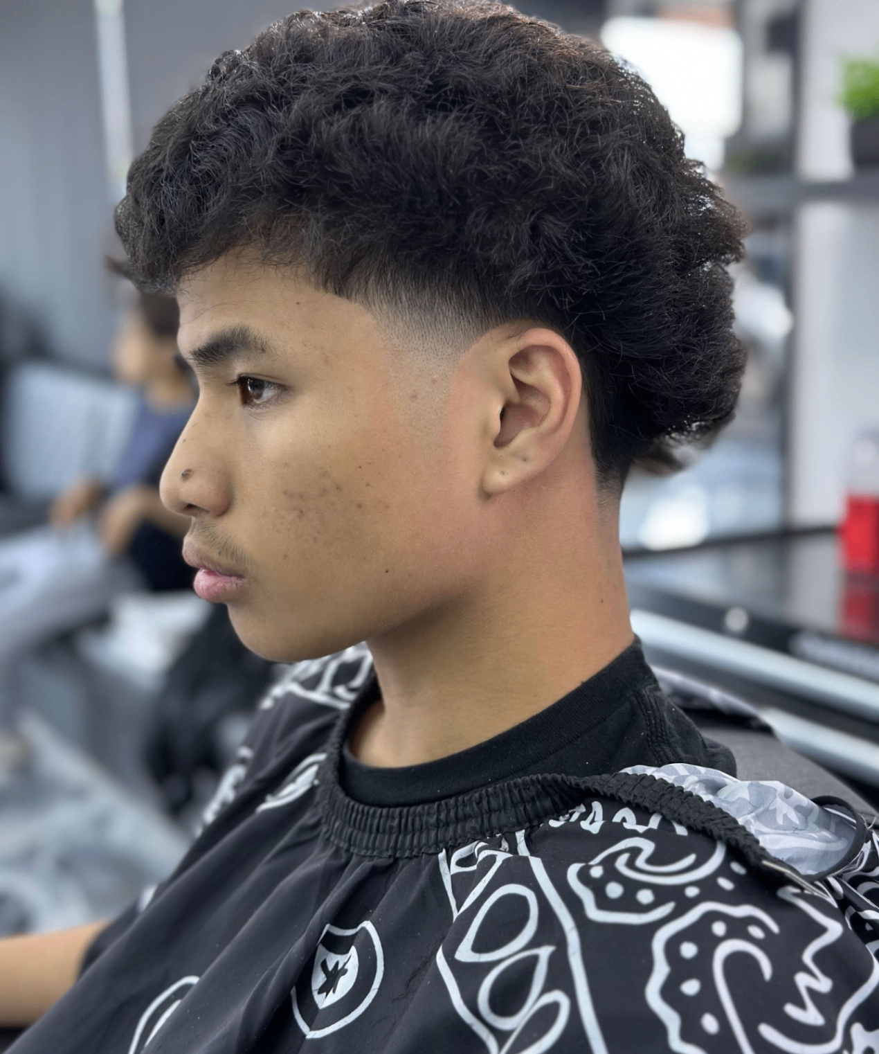 Wavy mullet fade haircut