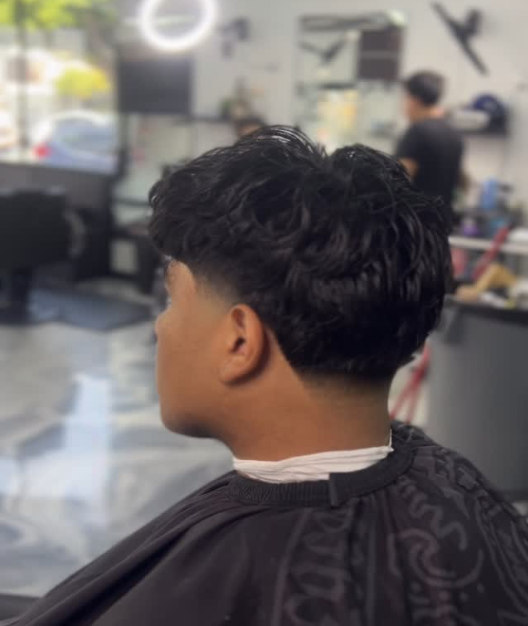 Soft textured taper haircut from the back